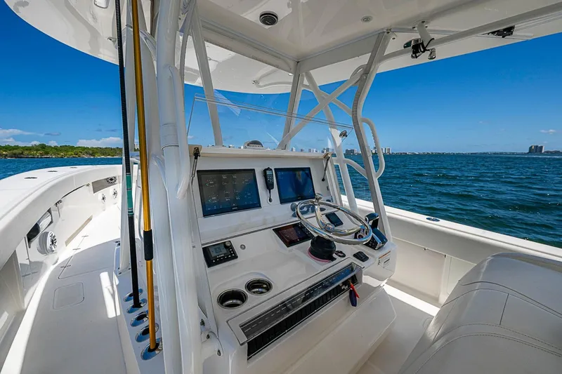 Slide: The Image of 2023 SeaVee 390B boat cockpit with modern controls and ocean view. - 23