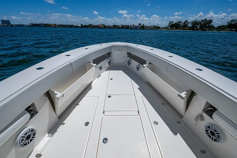 Slide: The Image of 2023 SeaVee 390B boat deck with storage compartments and ocean view. - 3