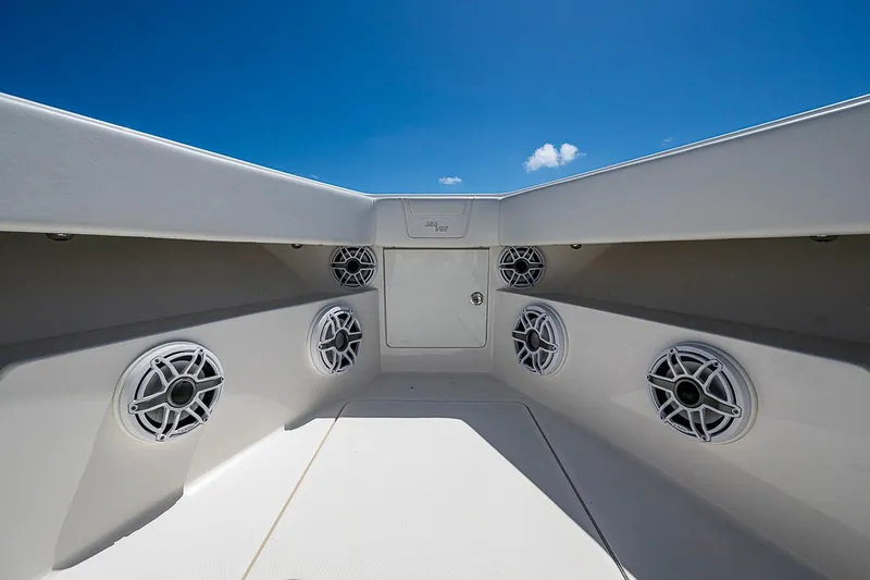 Slide: The Image of 2023 SeaVee 390B boat interior with multiple speakers, under a clear blue sky. - 6