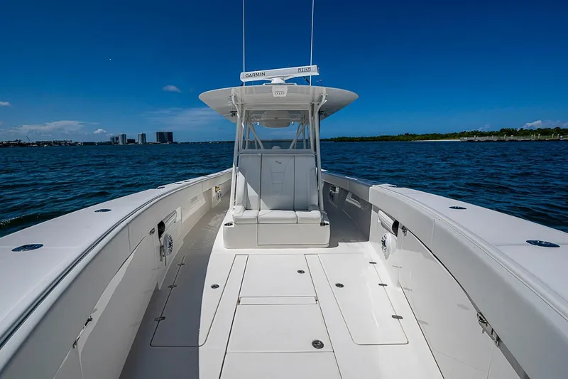 Slide: The Image of 2023 SeaVee 390B boat on open water, showcasing spacious deck and modern design. - 7