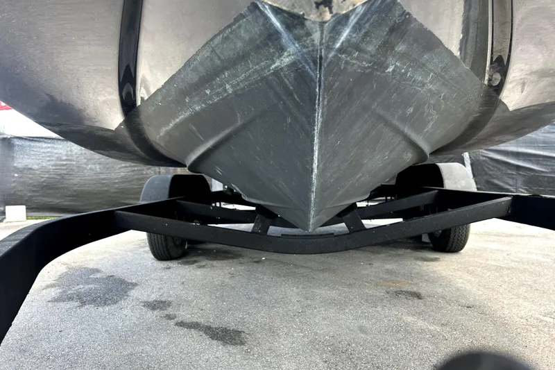Slide: The Image of 2020 Four Winns HD220 boat hull on trailer, close-up view. - 10