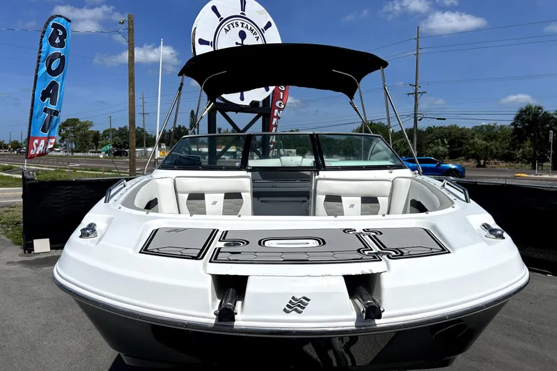 Slide: The Image of 2020 Four Winns HD220 boat displayed for sale under clear blue sky. - 11