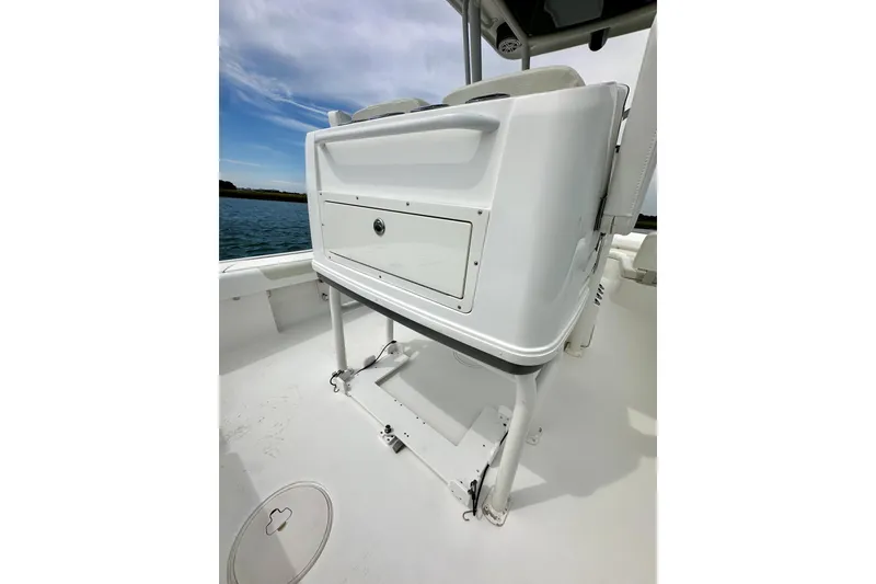 Slide: The Image of 2020 Caymas 26 HB boat interior with storage compartment and seating. - 15