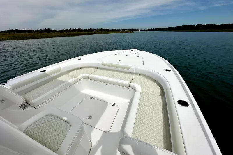 Slide: The Image of 2020 Caymas 26 HB boat with spacious seating on calm water. - 23