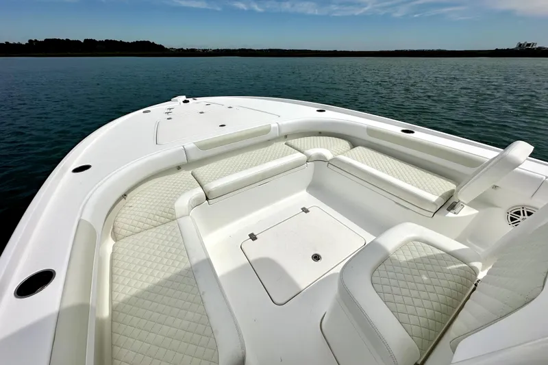Slide: The Image of 2020 Caymas 26 HB boat with spacious seating on calm water. - 24