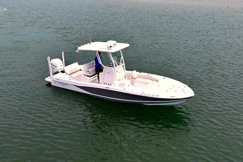 Slide: The Image of 2020 Caymas 26 HB boat on calm water, featuring sleek design and modern amenities. - 27
