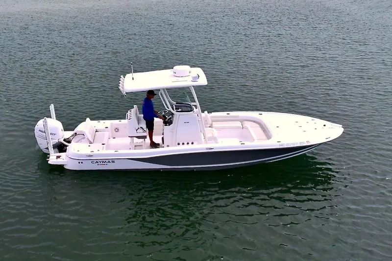 Slide: The Image of 2020 Caymas 26 HB boat on water, featuring sleek design and modern amenities. - 5
