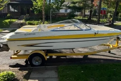 Slide: The Image of 2007 Glastron GT 205 boat on trailer, parked in a residential area. - 3