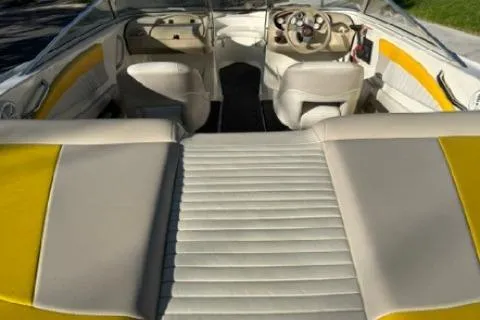 Slide: The Image of 2007 Glastron GT 205 boat interior with yellow and beige seating. - 8