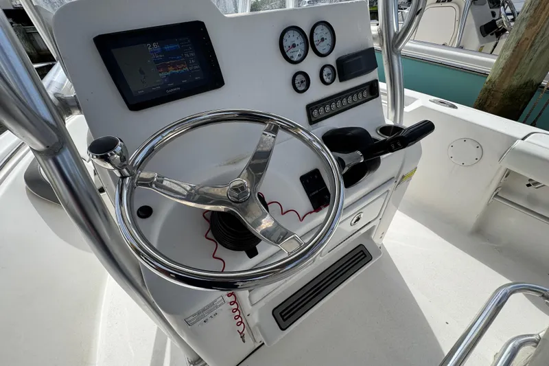 Slide: The Image of 2020 Tidewater 198 CC Adventure boat console with steering wheel and gauges. - 10