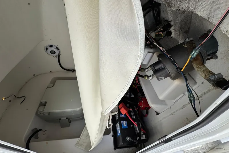 Slide: The Image of Interior view of a 2020 Tidewater 198 CC Adventure boat showing equipment and wiring. - 12