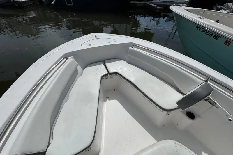 Slide: The Image of 2020 Tidewater 198 CC Adventure boat interior with white seating and stainless steel railings. - 14