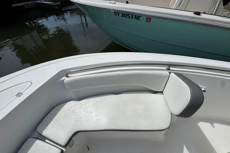 Slide: The Image of 2020 Tidewater 198 CC Adventure boat interior with cushioned seating. - 15