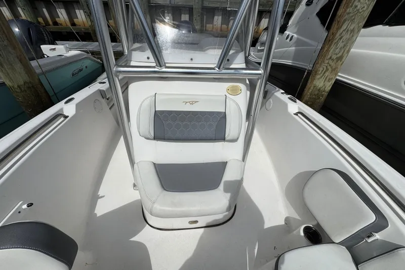 Slide: The Image of 2020 Tidewater 198 CC Adventure boat interior with seating and console. - 16