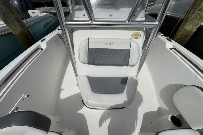 Slide: The Image of 2020 Tidewater 198 CC Adventure boat interior with cushioned seating and stainless steel railings. - 19