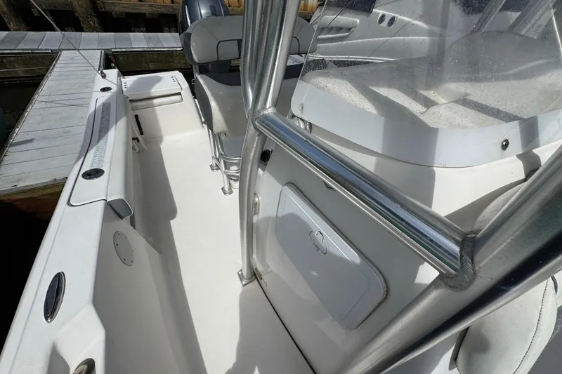 Slide: The Image of 2020 Tidewater 198 CC Adventure boat interior with seating and storage compartments. - 21