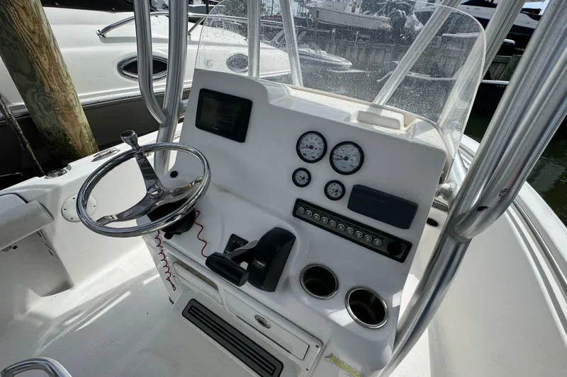 Slide: The Image of 2020 Tidewater 198 CC Adventure boat console with steering wheel and gauges. - 23
