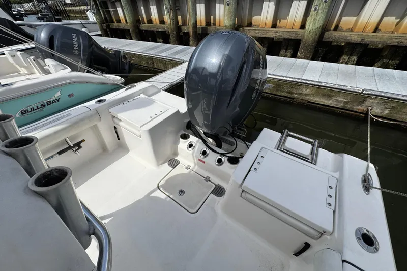 Slide: The Image of 2020 Tidewater 198 CC Adventure boat with Yamaha outboard motor docked at marina. - 3