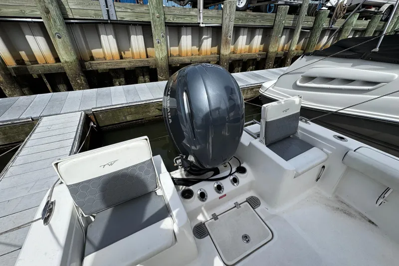 Slide: The Image of 2020 Tidewater 198 CC Adventure boat with outboard motor at dock. - 4