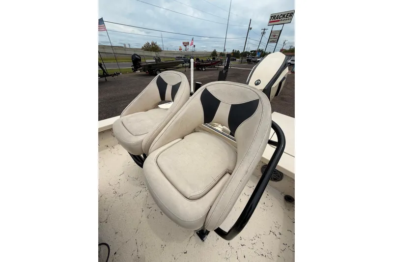 Slide: The Image of 2017 Majek 25 Xtreme boat seats with black and beige upholstery, parked outdoors. - 10