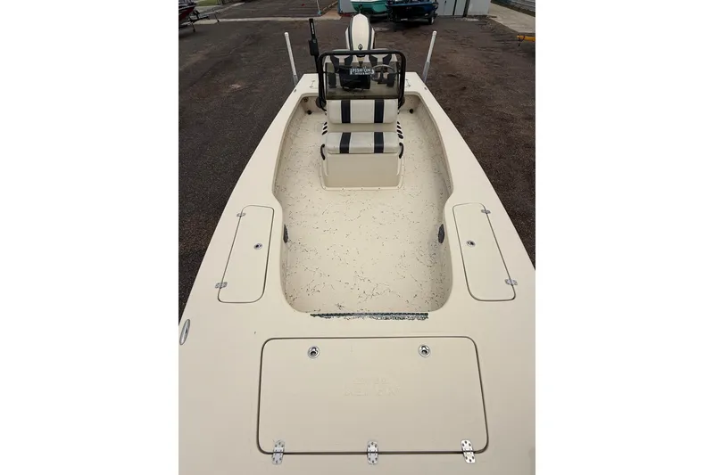 Slide: The Image of 2017 Majek 25 Xtreme boat interior with storage compartments and seating. - 7
