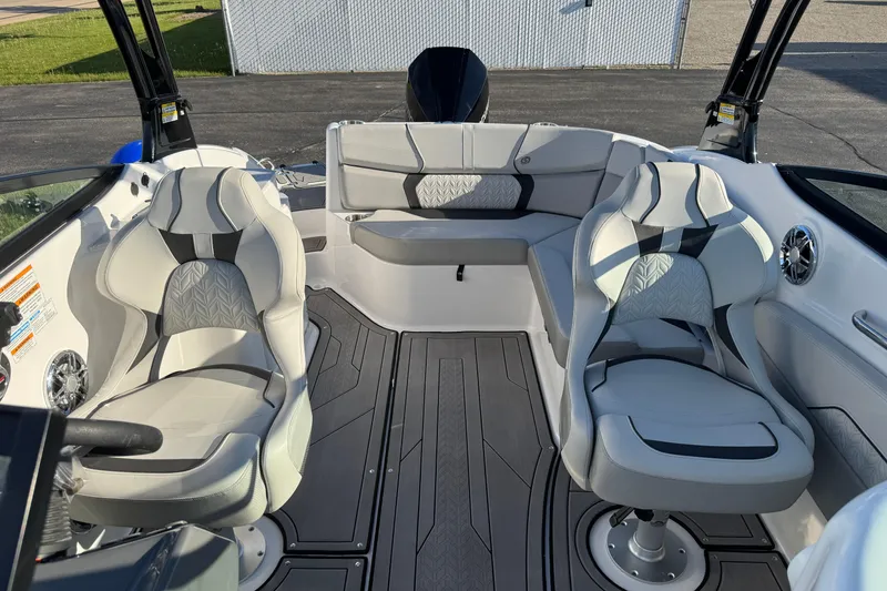 Slide: The Image of Interior of 2025 Hurricane SunDeck 2400 OB boat with modern seating and sleek design. - 10