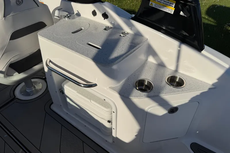 Slide: The Image of 2025 Hurricane SunDeck 2400 OB boat interior with seating and cup holders. - 12