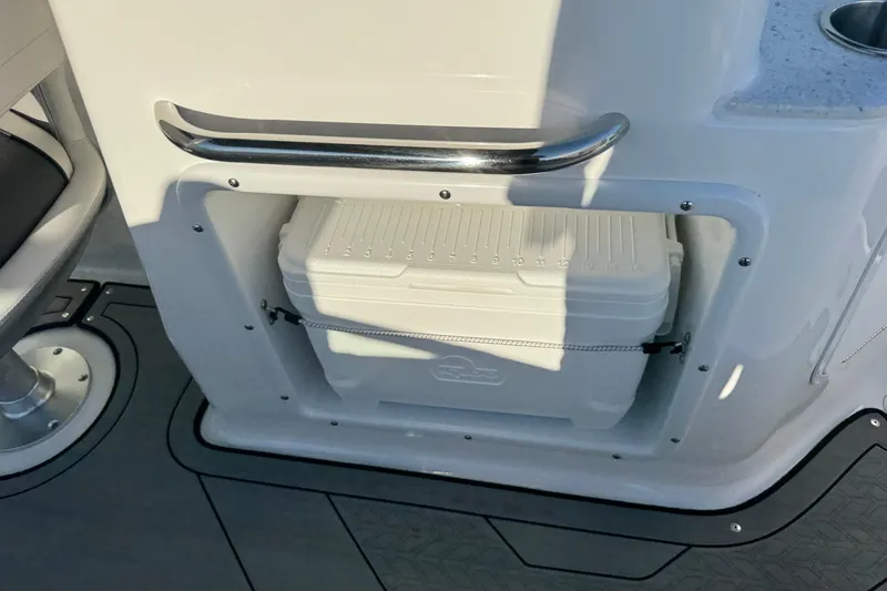 Slide: The Image of 2025 Hurricane SunDeck 2400 OB boat interior with built-in cooler storage. - 15
