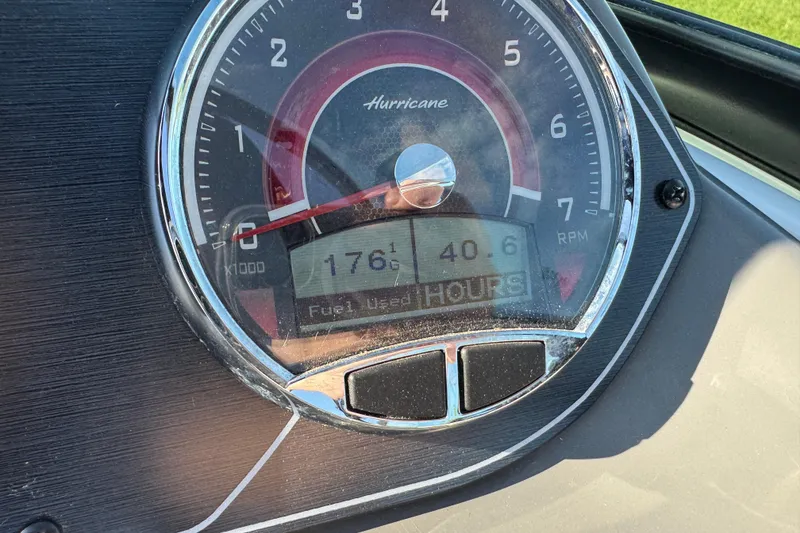 Slide: The Image of Close-up of 2025 Hurricane SunDeck 2400 OB tachometer displaying 1761 RPM and 40.6 hours. - 18