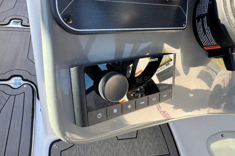 Slide: The Image of Control panel of 2025 Hurricane SunDeck 2400 OB boat with audio system. - 19