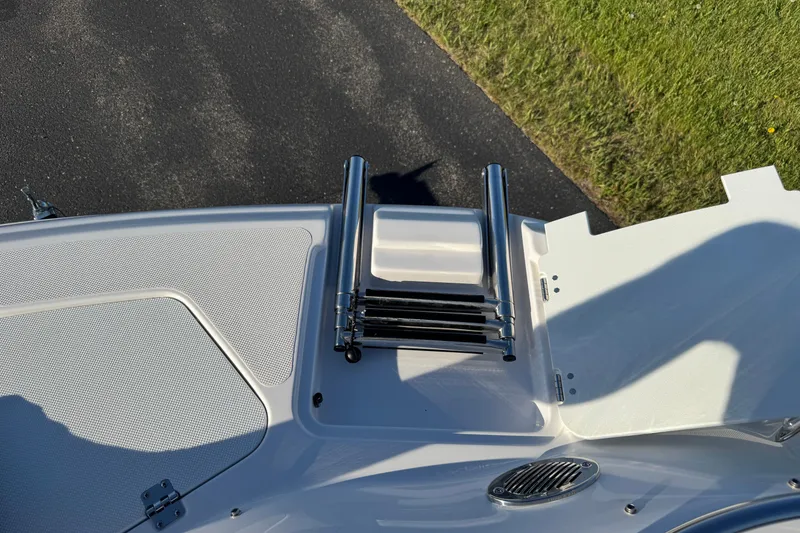 Slide: The Image of 2025 Hurricane SunDeck 2400 OB boat ladder and deck detail. - 28