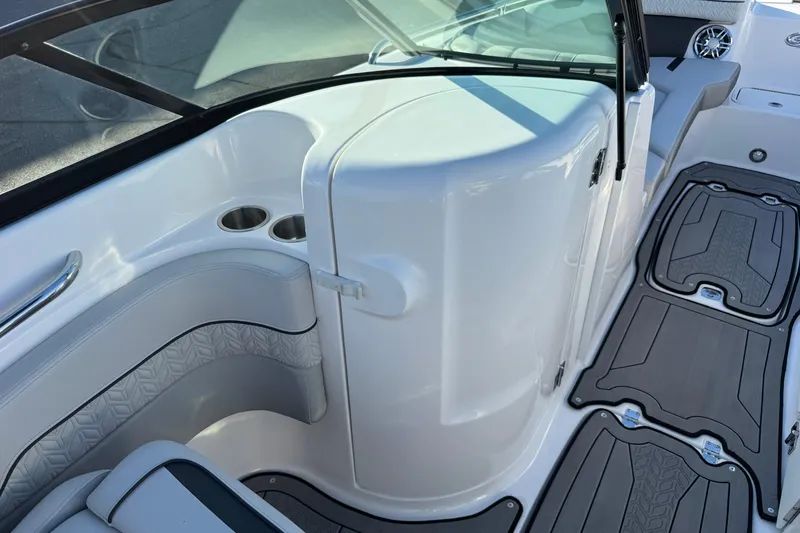 Slide: The Image of 2025 Hurricane SunDeck 2400 OB interior with seating, cup holders, and non-slip flooring. - 34