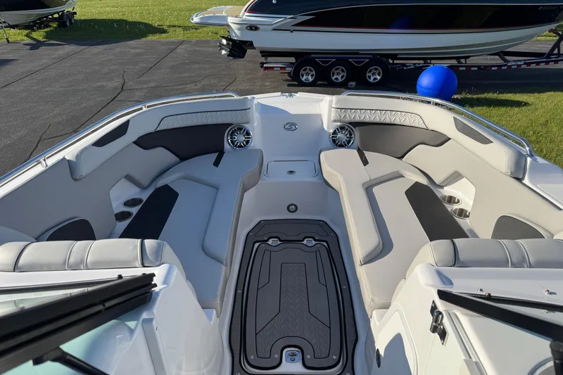 Slide: The Image of 2025 Hurricane SunDeck 2400 OB boat interior with spacious seating and modern design. - 40