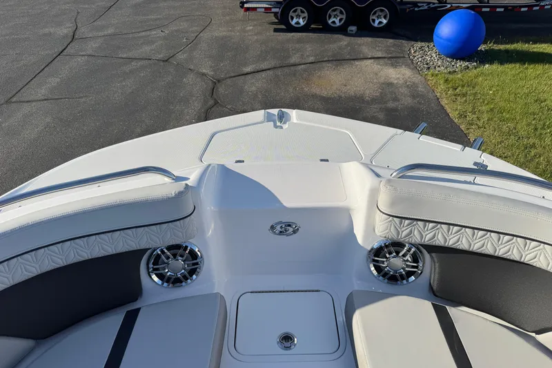 Slide: The Image of 2025 Hurricane SunDeck 2400 OB boat interior with cushioned seating and speaker system. - 41