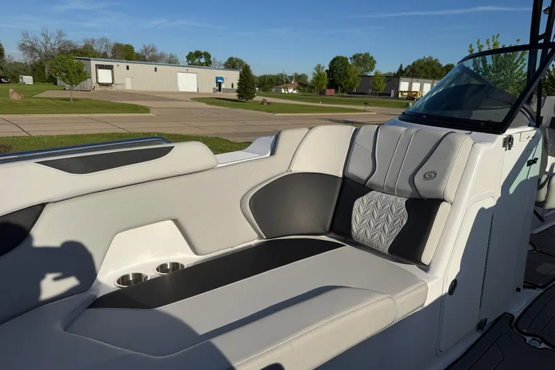 Slide: The Image of 2025 Hurricane SunDeck 2400 OB boat interior with stylish seating and cup holders. - 43