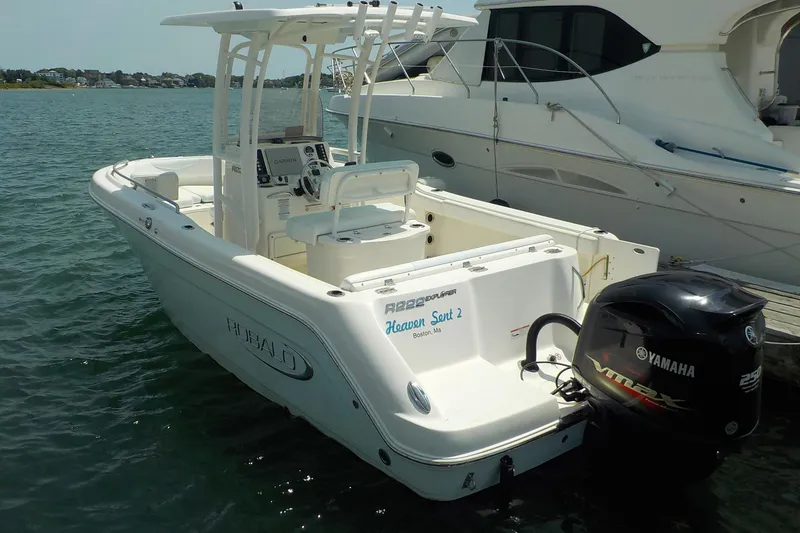 Slide: The Image of 2019 Robalo R222 Center Console boat docked with Yamaha outboard motor. - 1