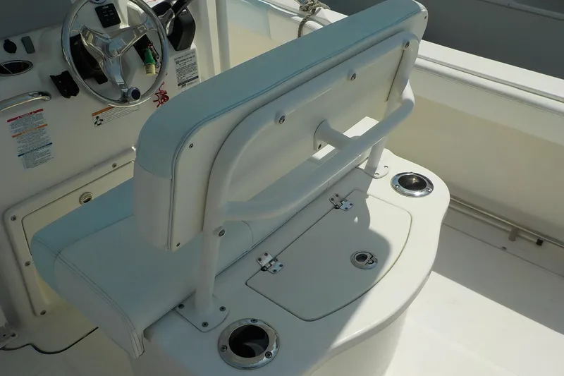 Slide: The Image of 2019 Robalo R222 Center Console boat interior with steering wheel and seating. - 11