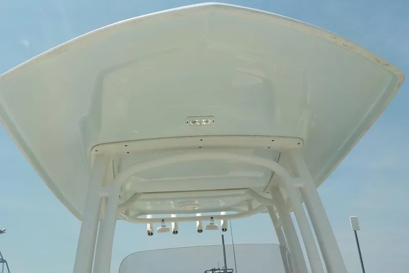 Slide: The Image of 2019 Robalo R222 Center Console boat's T-top against a clear blue sky. - 14