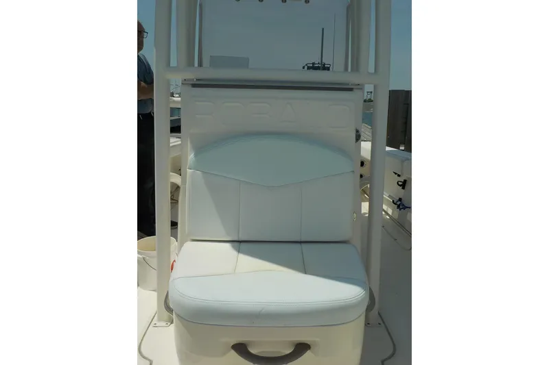 Slide: The Image of 2019 Robalo R222 Center Console boat seat, white upholstery, sturdy frame. - 15