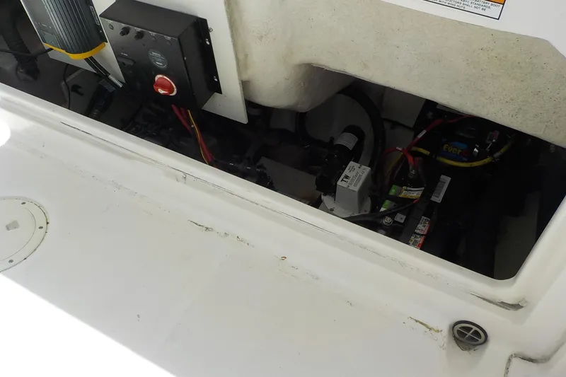 Slide: The Image of 2019 Robalo R222 Center Console boat interior wiring and battery compartment. - 22