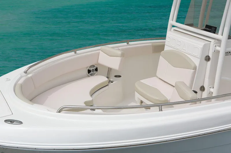 Slide: The Image of Manufacturer Provided Image: 2019 Robalo R222 Center Console boat with white seating and turquoise water background. - 29
