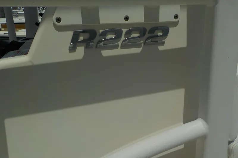 Slide: The Image of 2019 Robalo R222 Center Console boat emblem in close-up view. - 4