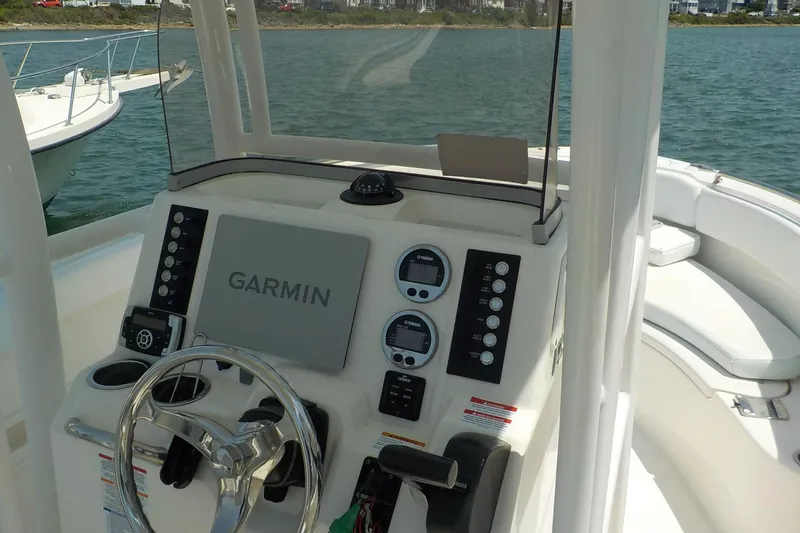 Slide: The Image of 2019 Robalo R222 Center Console boat dashboard with Garmin navigation system. - 5