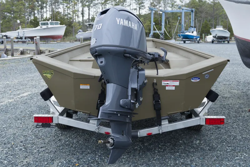 Slide: The Image of 2026 G3 Gator Tough 18 DK boat with Yamaha motor on trailer at marina. - 7