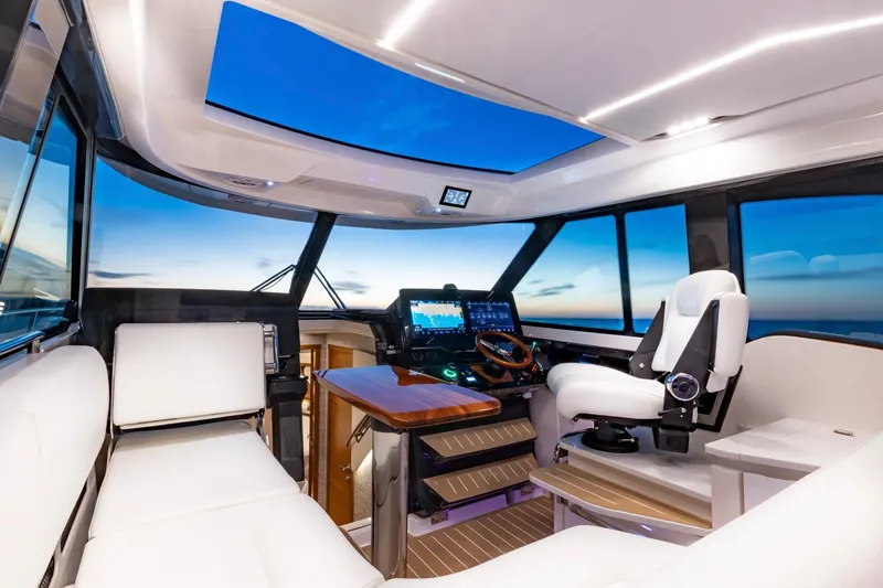 Slide: The Image of Manufacturer Provided Image: Luxurious interior of 2026 Tiara Yachts 39 LE with modern helm and seating. - 13