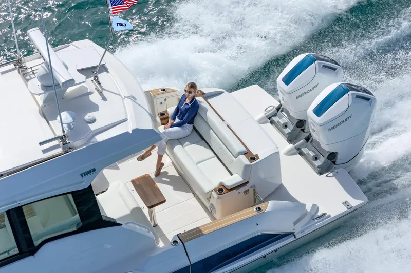 Slide: The Image of Manufacturer Provided Image: 2026 Tiara Yachts 39 LE cruising with passenger, featuring dual Mercury engines. - 7