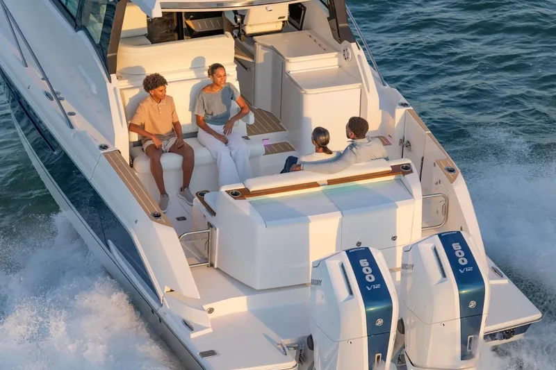 Slide: The Image of Manufacturer Provided Image: 2026 Tiara Yachts 39 LE cruising with passengers, featuring dual Mercury 600 V12 engines. - 8