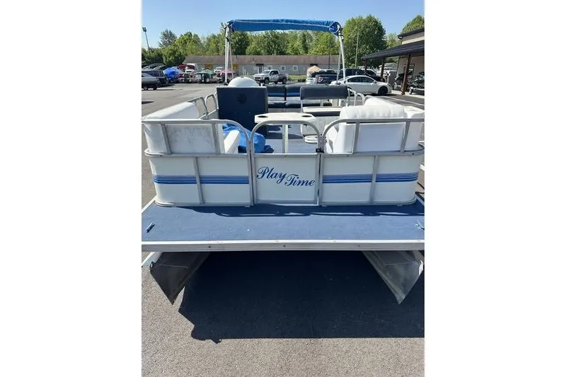 Slide: The Image of Pontoon boat "Playtime" DL2022, 2002 model, parked outdoors on a sunny day. - 6