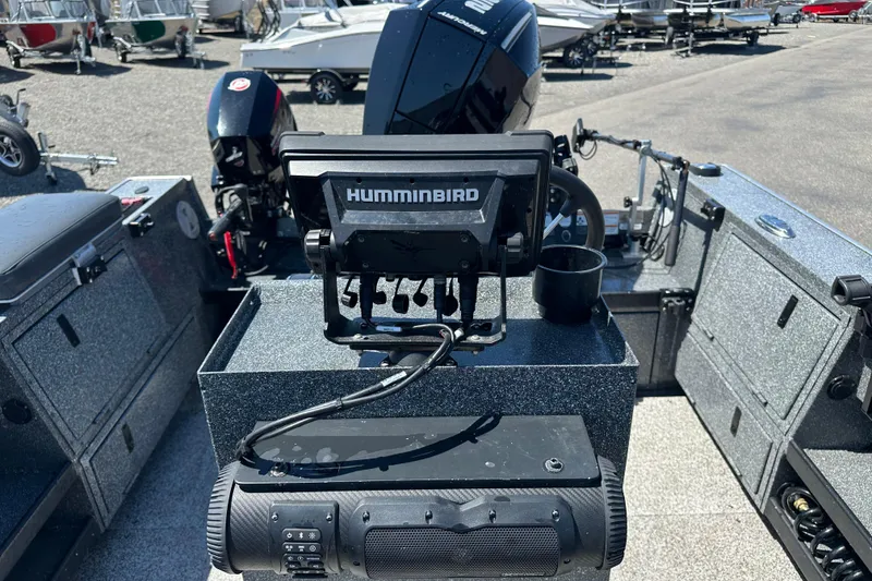 Slide: The Image of 2024 Alumaweld Columbia 25 boat interior with Humminbird fish finder and motor. - 10