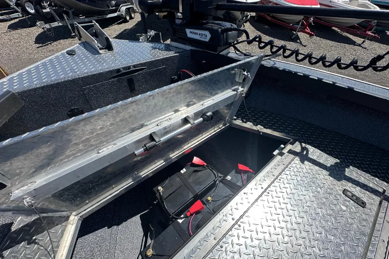 Slide: The Image of 2024 Alumaweld Columbia 25 boat with open storage compartment and battery. - 12